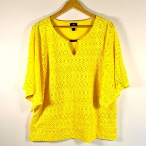 Vibrant yellow eyelet lace flutter short sleeve v-neck banded hem poncho blouse